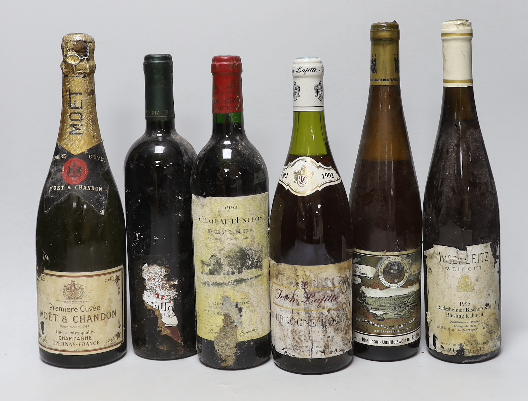 A bottle of Moët Chandon champagne and eleven various bottles of wine to include 1992 Jean Lafitte Bourgogne Rouge, 1994 Chateau L’Enclos Pomerol, 1975 Chateau Batailley Pauillac, 1994 Deen De Bortoli Cabernet Sauvignon